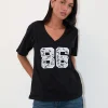Motel Rocks Printed Tops | Tees-Blaine Oversized Tee in Black with 86 White Lace Embroidery