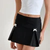 Motel Rocks Tailoring | Co-Ords-Ropita Mini Skirt in Black with Ivory Bows