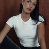 Motel Rocks Basics | Basic Tops-Suti Ribbed Baby Tee in Off White with Blue Bow M Embroidery offwhitewithbluebowmemb